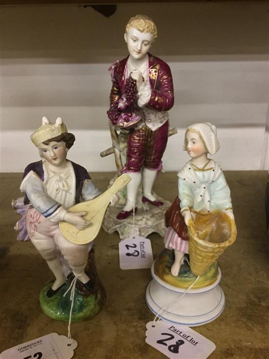 Continental porcelain figure with grapes and two bisque figures(-)